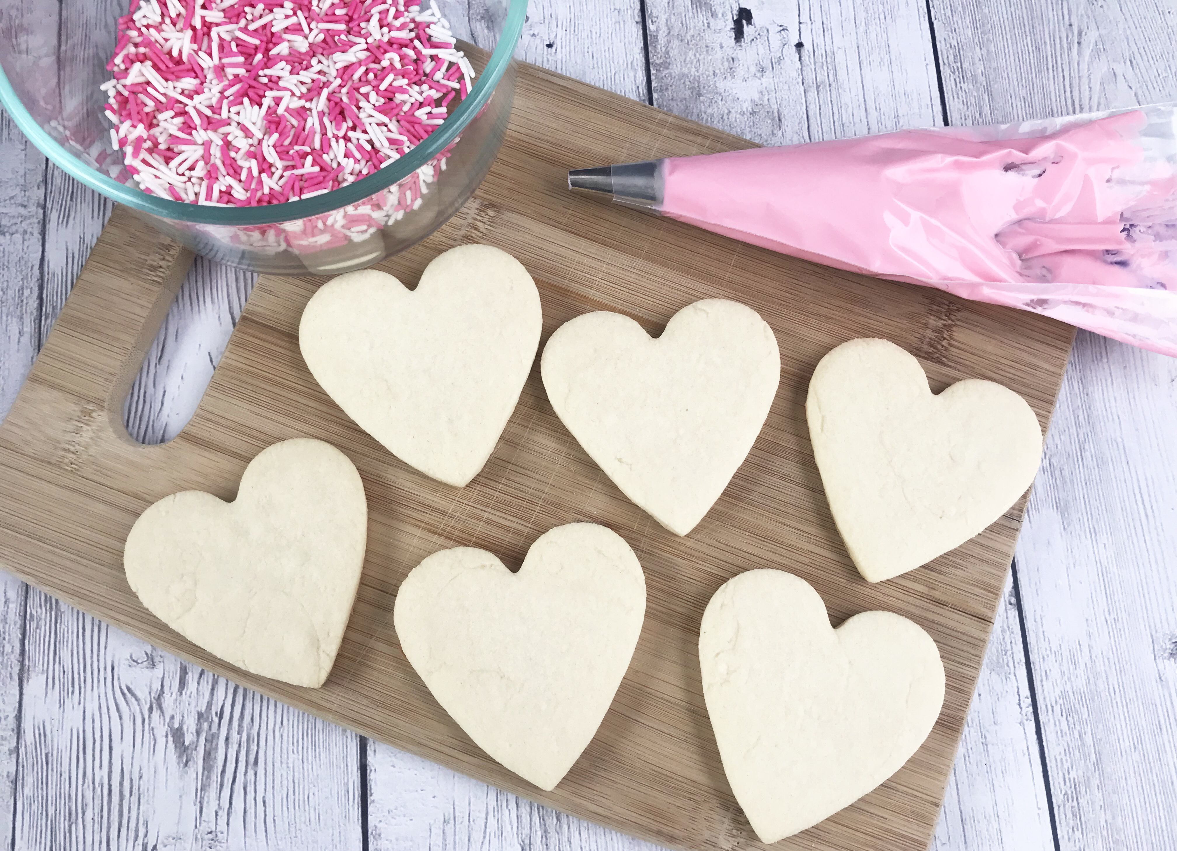 Cooled heart shaped sugar cookies ready to decorate