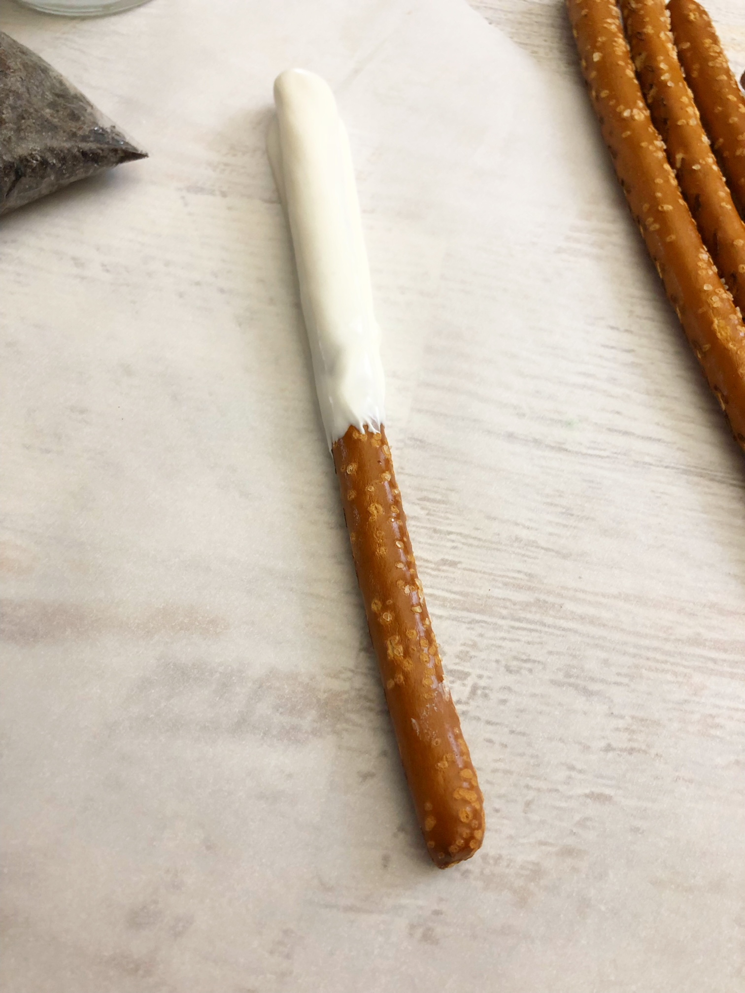 Pretzel rod dipped in white chocolate